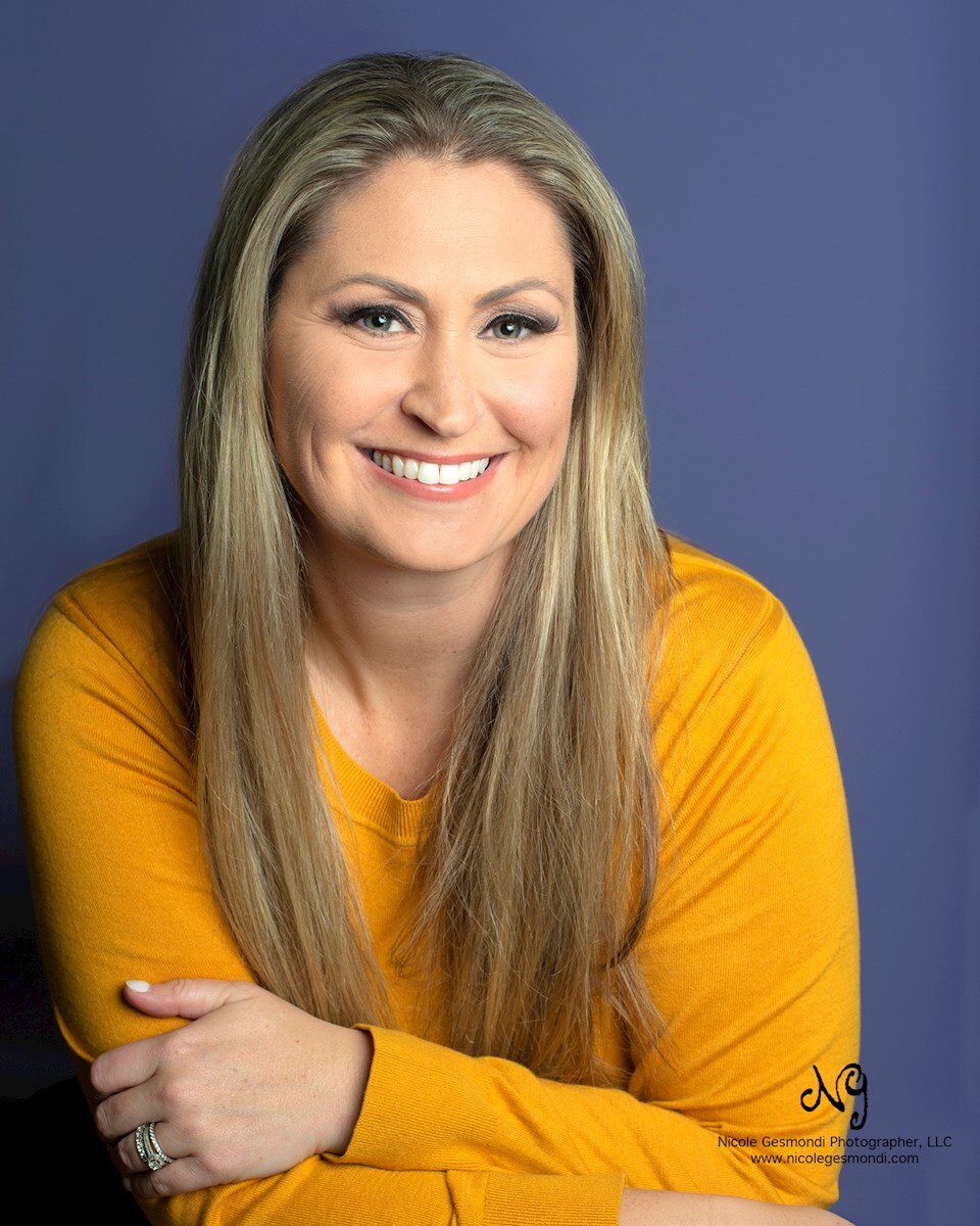 colorful female headshot purple background