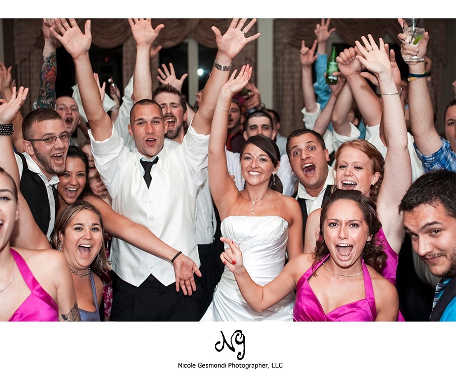 happy wedding guests on the dance floor