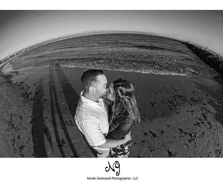 black and white engagement photos by the beach in Rhode Island