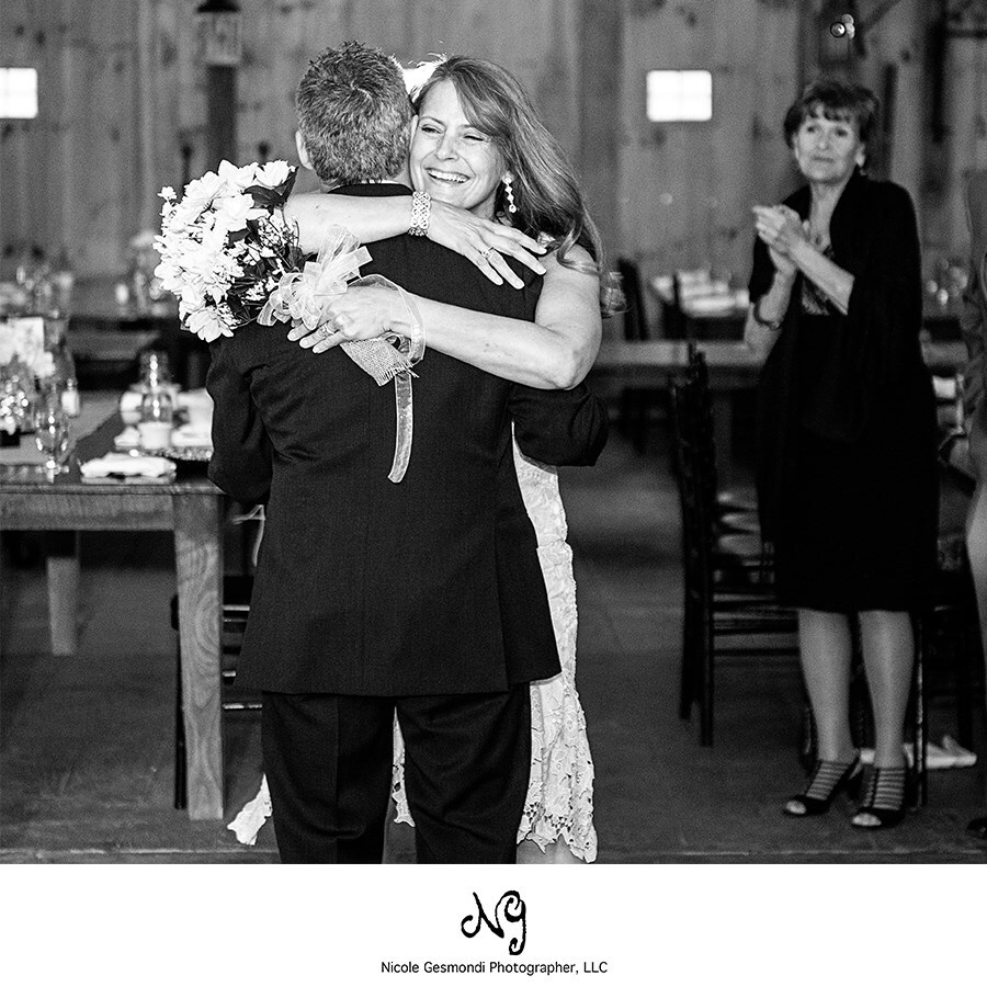 Black and white wedding photos of the bride and groom dancing at their wedding