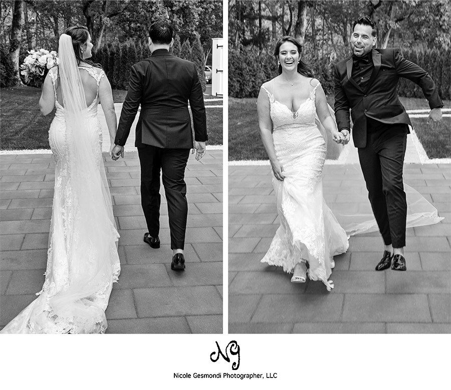 black and white wedding photo of bride and groom skipping